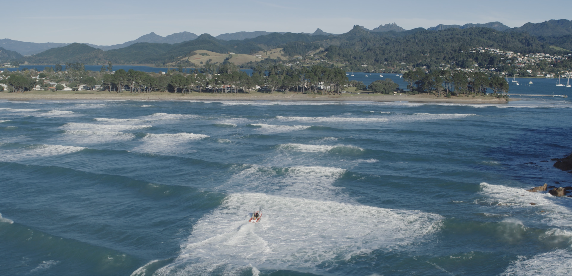 Coastguard rescue vessel crossing Tairua bar 01