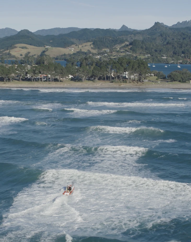 Coastguard rescue vessel crossing Tairua bar 01