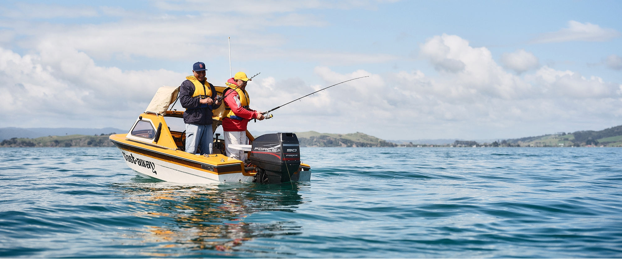 Fishing on small boat banner
